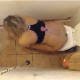 A hidden camera records an attractive blonde girl taking a piss and shit while sitting on a toilet. Plops and farting can be heard as she grunts. There is no toilet paper, so she wipes with one of her socks. Over 4.5 minutes.